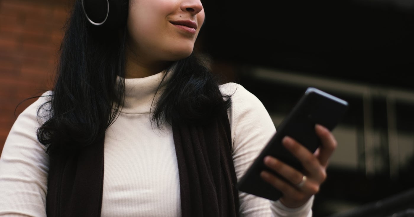 Person looking at smartphone screen - screen time statistics